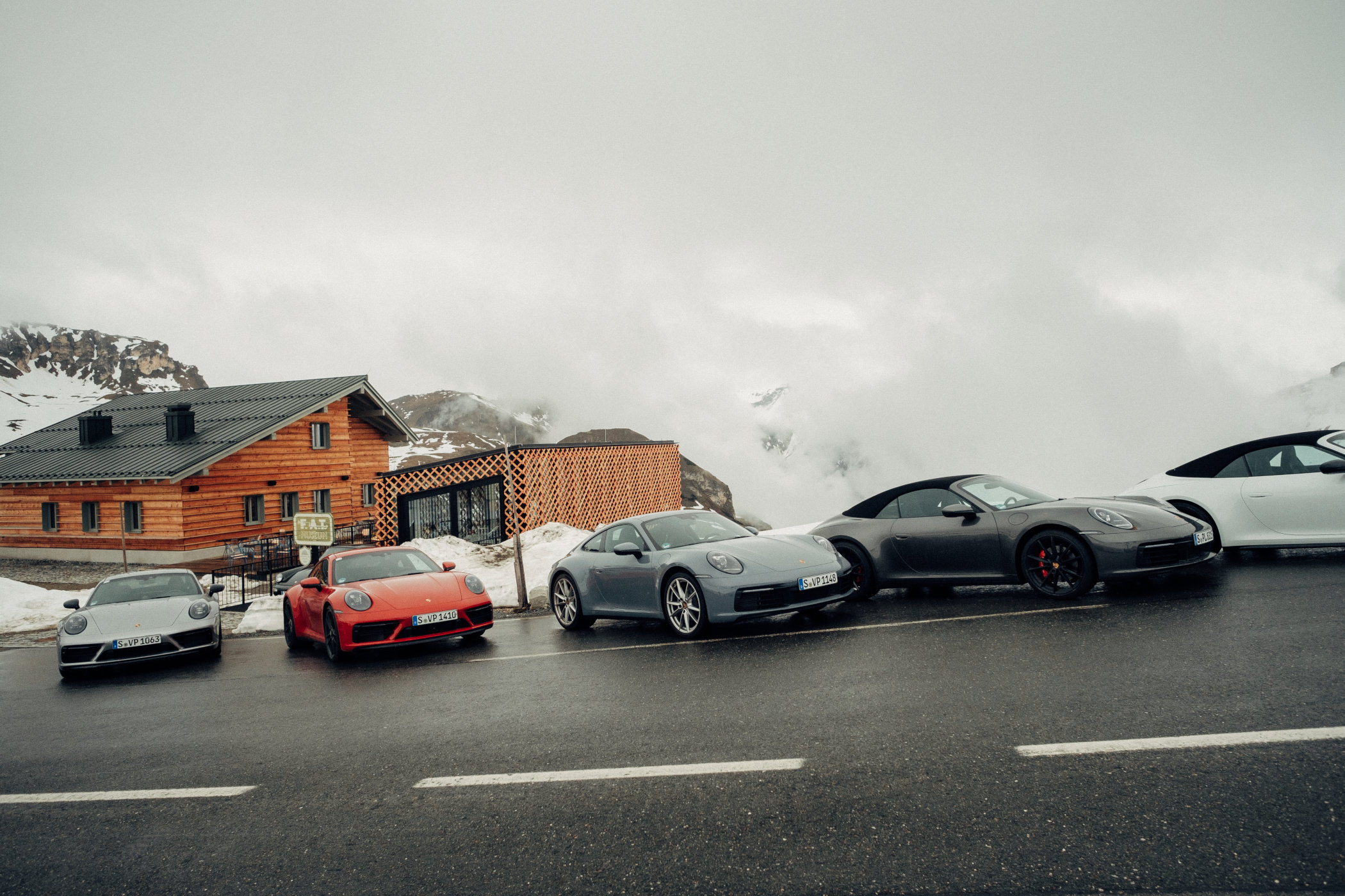 A line-up of Porsche 911 sports cars outside of the Mankei restaurant 2 A line-up of Porsche 911 sports cars outside of the Mankei restaurant 2