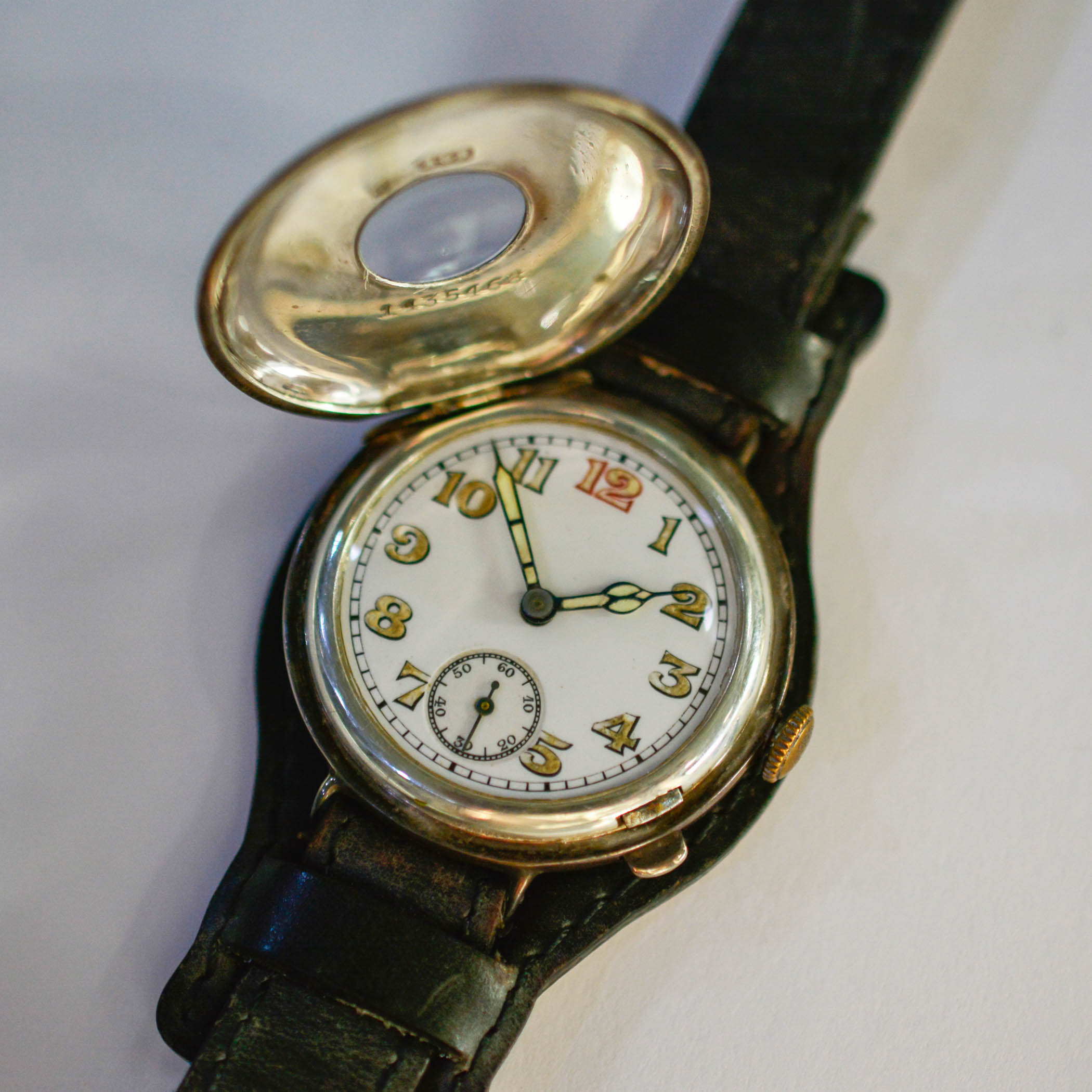 World War 1 era wristwatch with half-hunter case