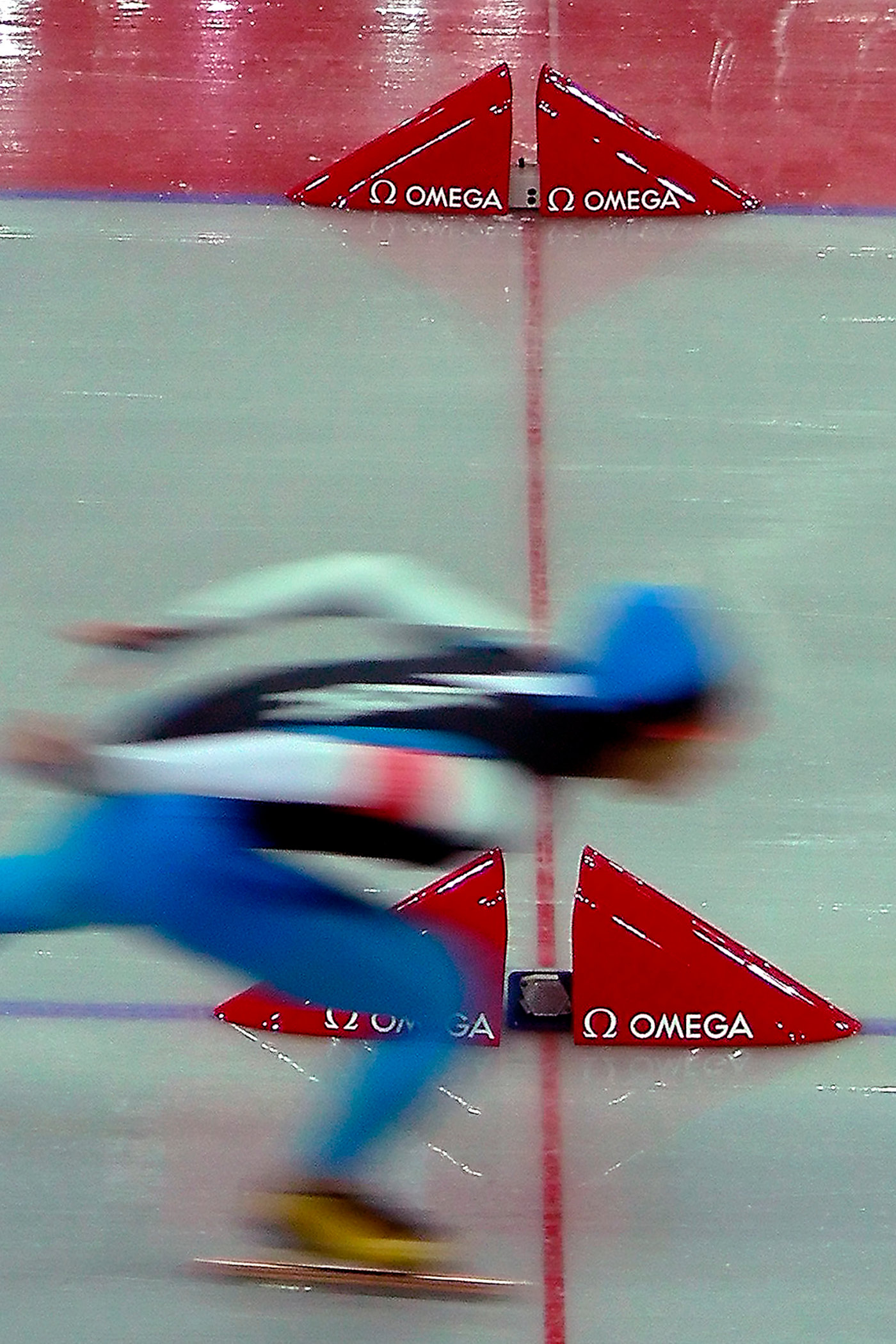 A speed skating finish photo from the 2006 Olympics in Turin, Italy.