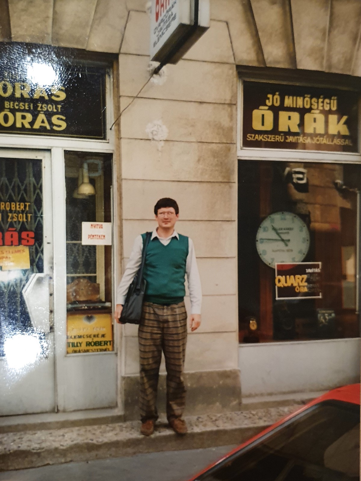 Aaron Becsei's father in front of his shop