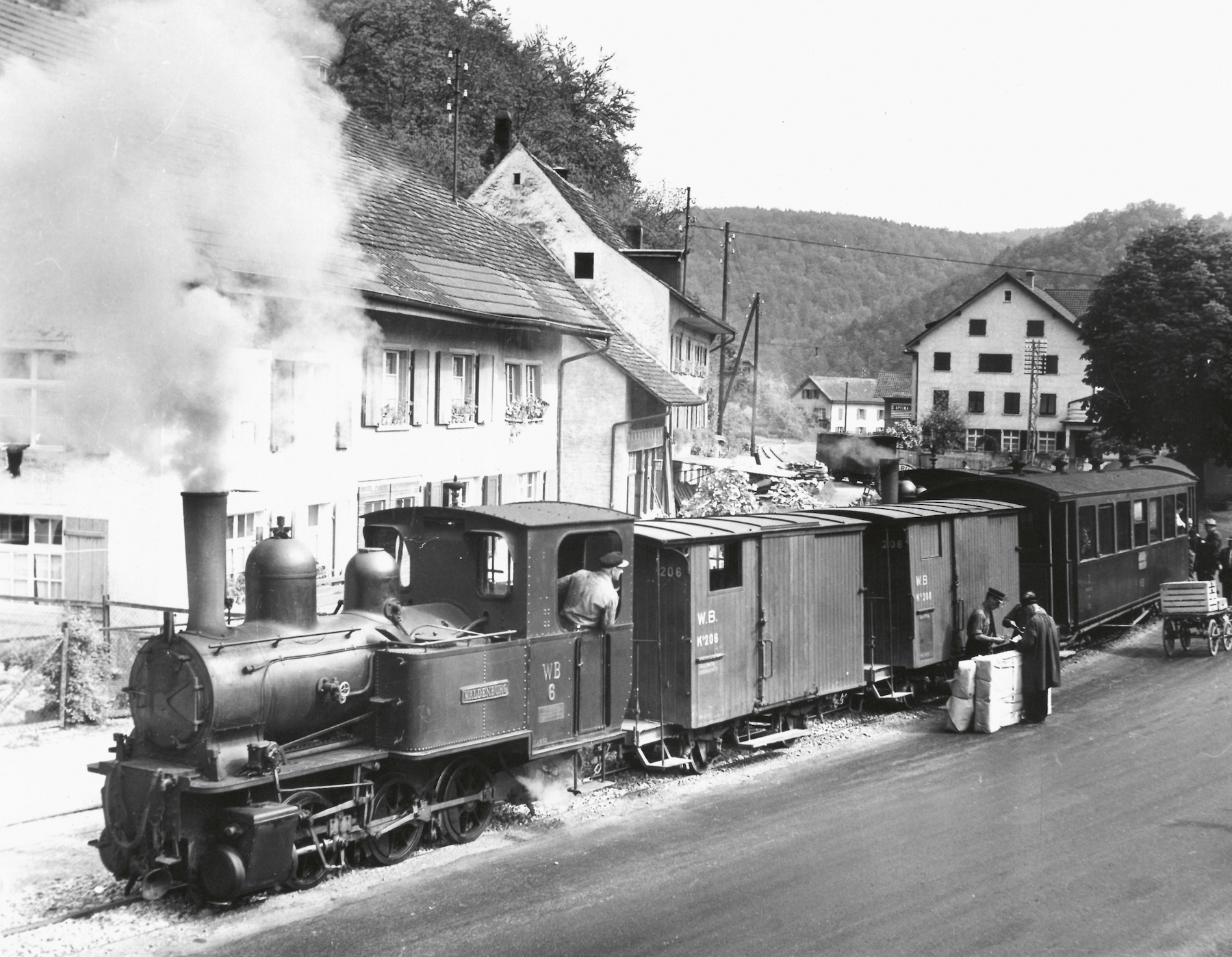 A steam locomotive brings goods and passengers into the Waldenburg Valley
